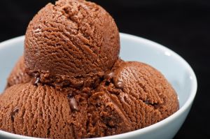 Chocolate ice cream over a black background