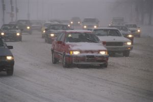 Traffic driving in snowstorm