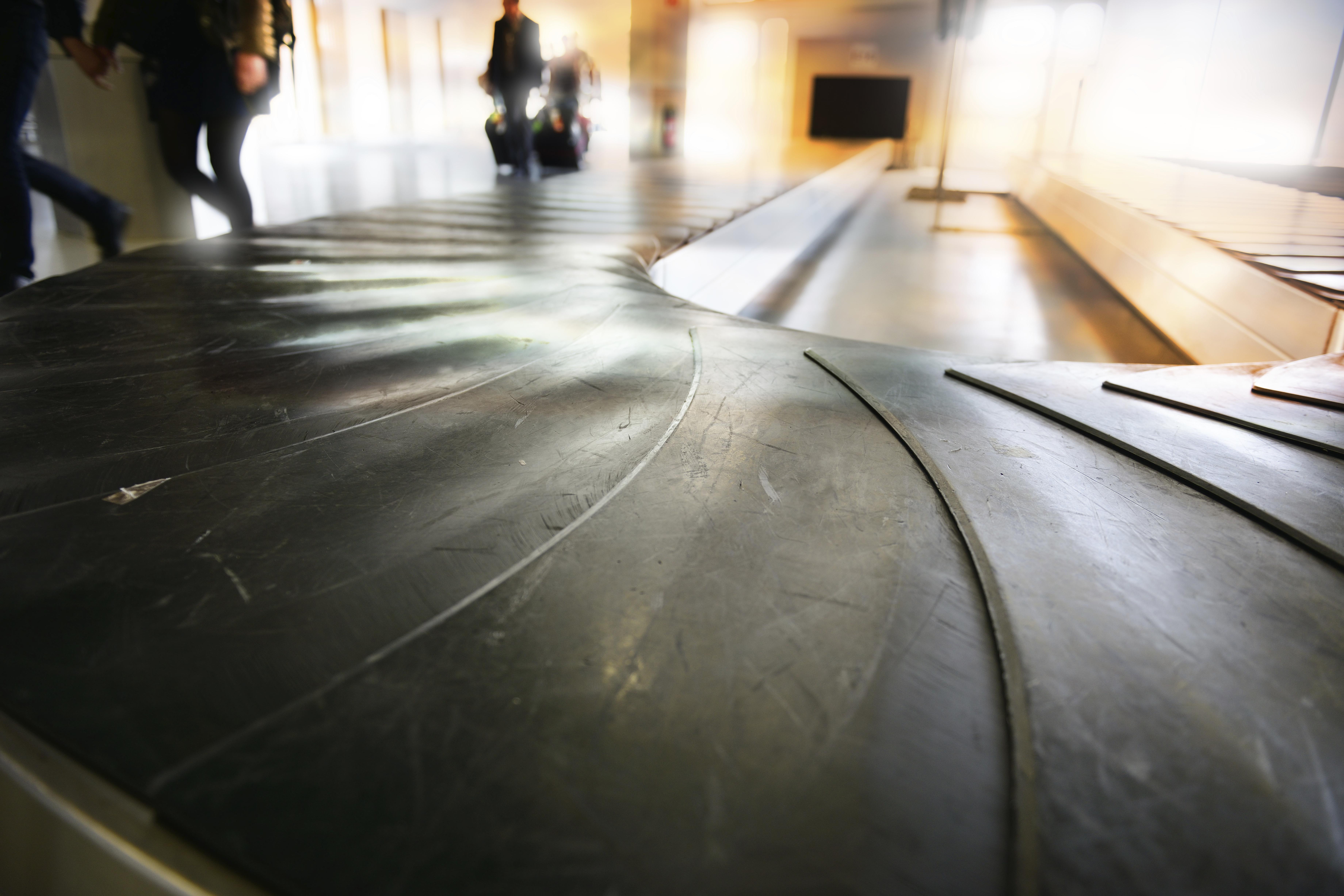 'Conveyour belt at airport, early morning'