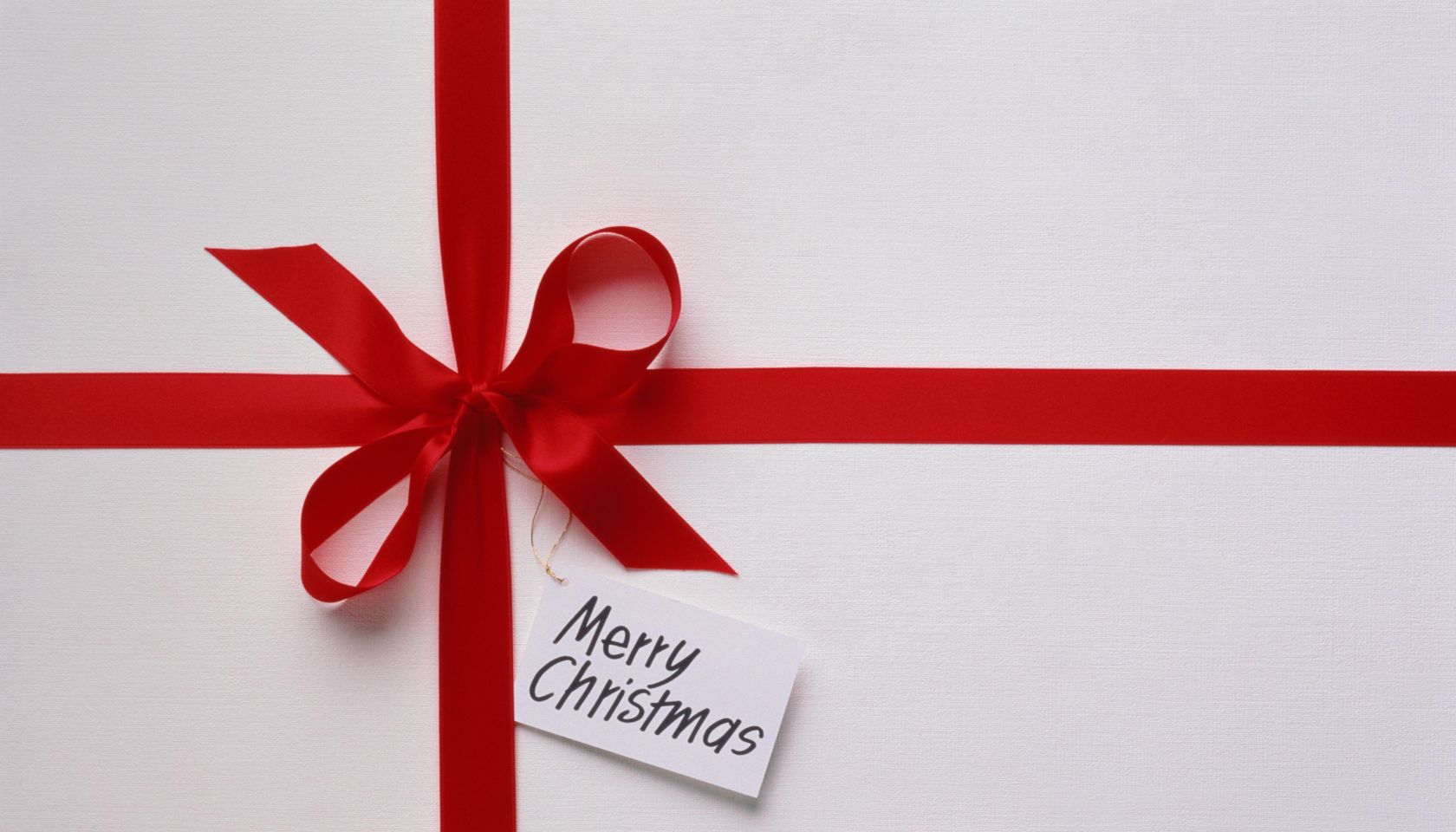 White Christmas present with tag saying 'Merry Christmas'