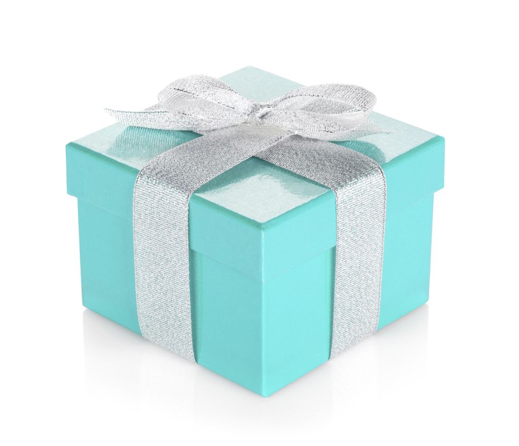 Blue gift box with silver ribbon and bow. Isolated on white background