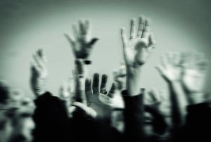 Hands Raised in a Crowd