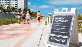 Miami Beach, South Beach, Spring Break closed public beaches sign police warning due to Coronavirus Pandemic