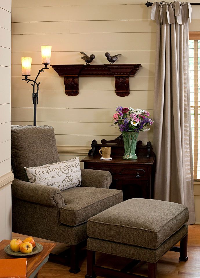 Vignette of chair and ottoman in guestroom