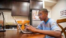 Young Black boy homeschooling
