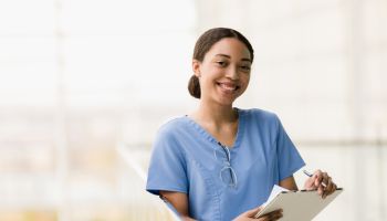 Female medical student smiles for camera before class