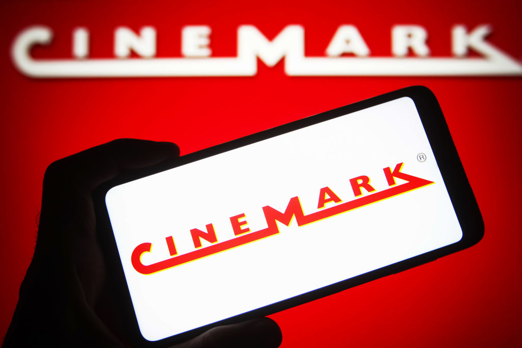 In this photo illustration a Cinemark Holdings, Inc. logo is...