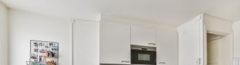 Cozy small kitchen interior in white colors