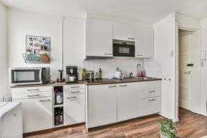 Cozy small kitchen interior in white colors