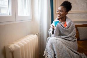 Woman feel cold in home with no heating