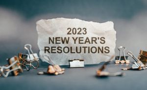 New year resolutions 2023 on desk. Goals, resolutions, plan, action, checklist concept. New Year 2023 background, copy space