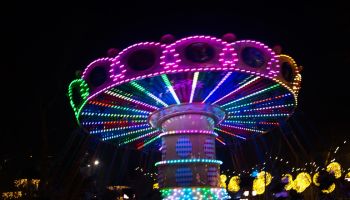 Carousel spinning at night park, twirl