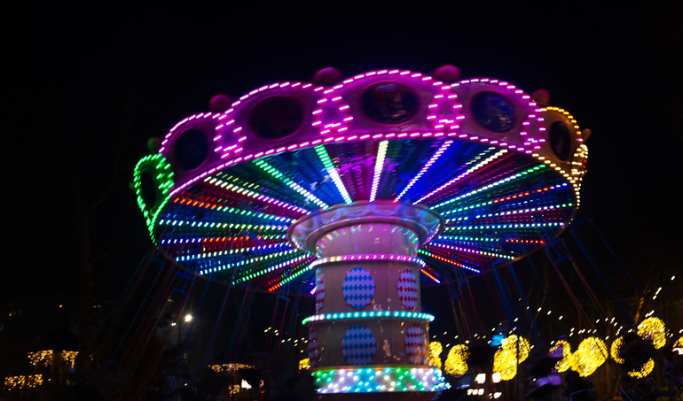Carousel spinning at night park, twirl