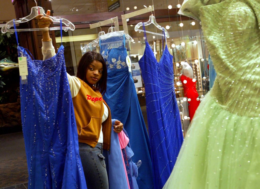 4/20/04- Bloomington, MN - Seventeen year old Henry High School Senior Tammy Sweezy of Minneapolis examines prom dresses with a critical eye Tuesday while shopping at Glitz at the Mall of America.