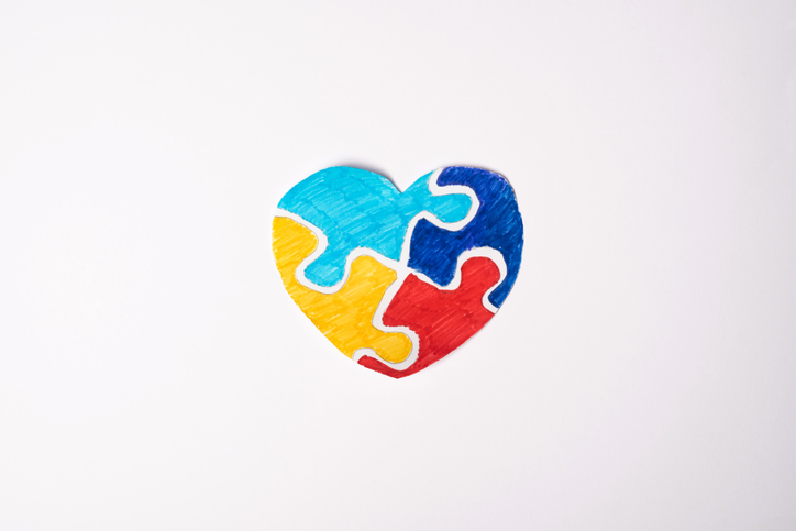 Colorful puzzle heart on a white background