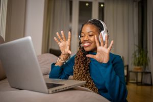 Young fashionable woman working at home