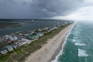Aerial views from over Wrightsville Beach North Carolina with an incoming storm
