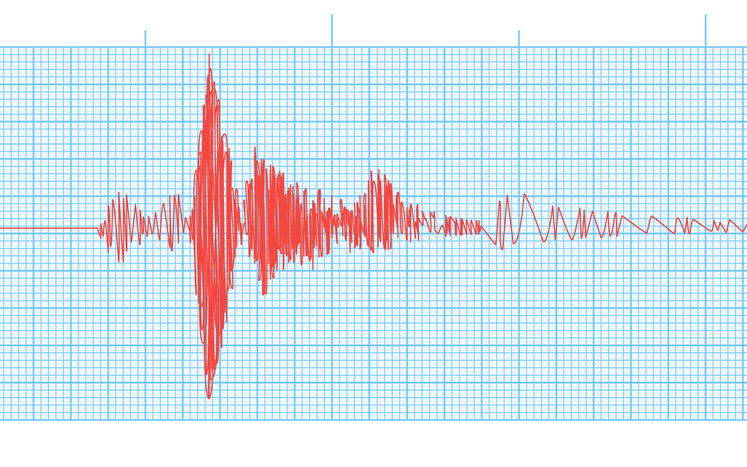 Seismogram of seismic activity or lie detector red record on blue chart paper