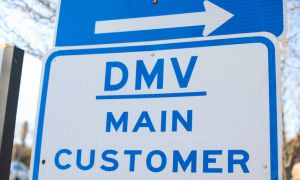 DMV sign street showing where to get drivers registration