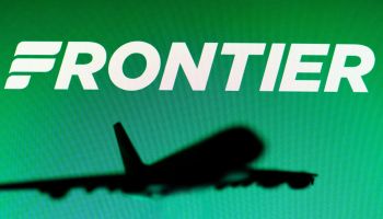 In this photo illustration, the Frontier Airlines logo is...