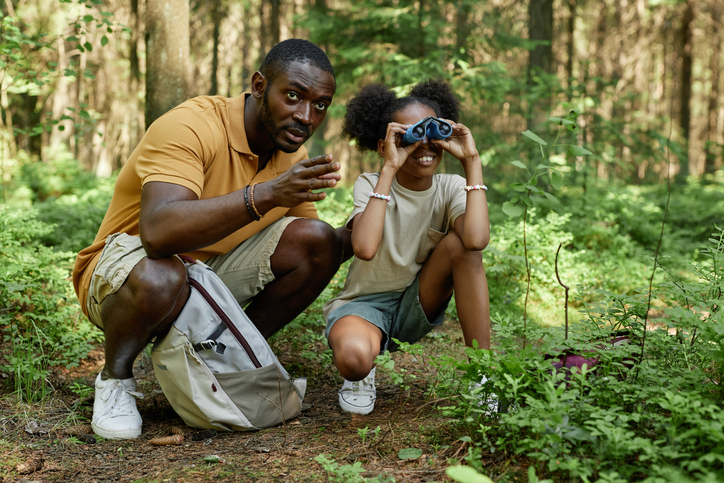 Dad teaching his daughter to hiking