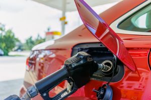 Gas Pump Refuels Car at Station