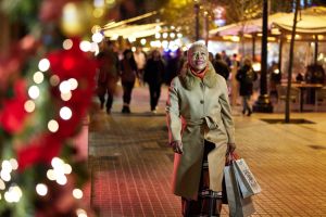 Senior woman walking back home after Christmas shopping