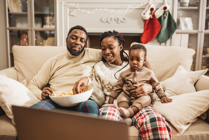 Family at home watching Christmas movies