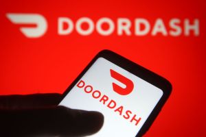 In this photo illustration the DoorDash logo of an US online...