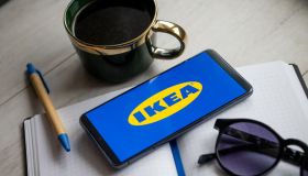 In this photo illustration a Ikea logo seen displayed on a...