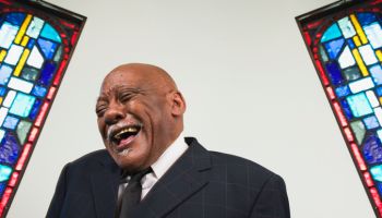 Senior African man laughing in church