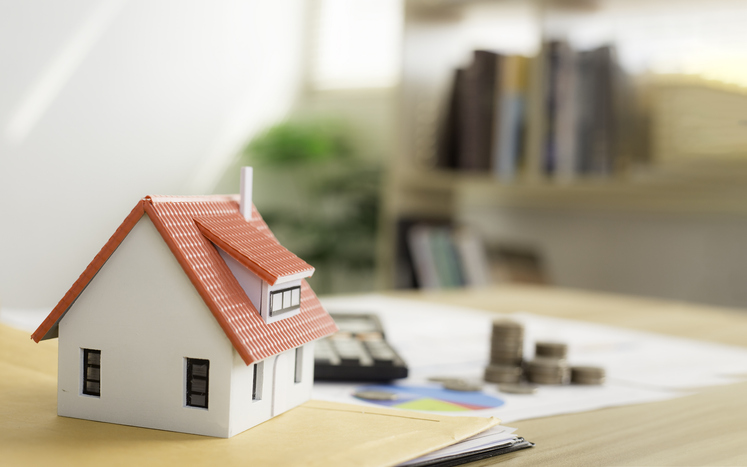 Property tax or home department. Mortgage. Home sale and home insurance concept. Contains documents related to real estate investments