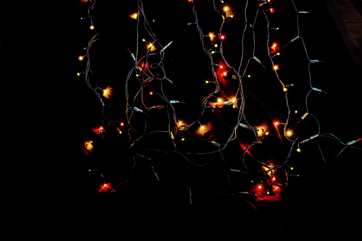 Christmas lights on a black background in the view